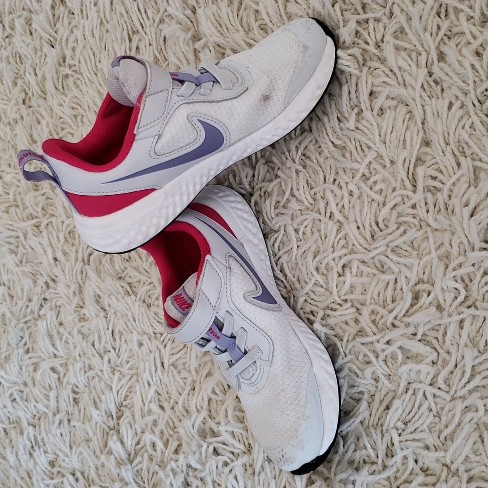 White and pink girls Nike sneakers